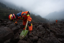 Rescue Efforts Ramp Up After Landslide Hit Sichuan Village