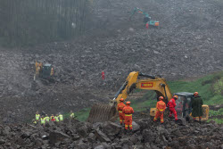 Rescue Efforts Ramp Up After Landslide Hit Sichuan Village