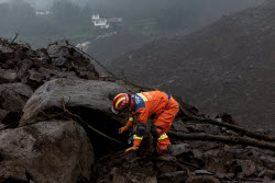 Rescue Efforts Ramp Up After Landslide Hit Sichuan Village