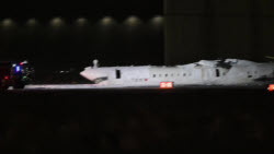 At least 18 injured as plane crashes, flips on landing in Toronto
