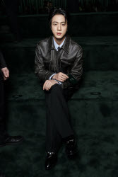 Jin attends GUCCI Autumn-Winter 2025 runway during Milan Fashion Week on February 2025 - Milan, Italy 25/02/2025