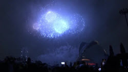 Fireworks shine through rain at Las Fallas in Valencia
