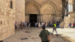 Faithful and tourists react to the death of the pope in the Church of the Holy Sepulchre