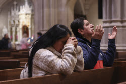 People visit St. Patrick's Cathedral to pay their respects to the late Pope Francis