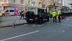 Car drives into group of people