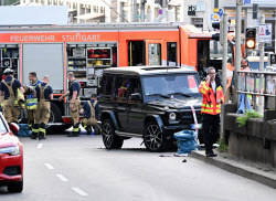 Car drives into group of people