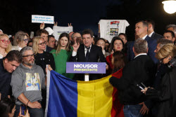 Reactions to first exit polls in Romania's presidential runoff