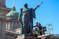 Washing Mikhail Kutuzov statue in St Petersburg, Russia