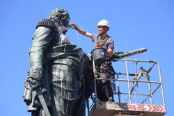 Washing Mikhail Kutuzov statue in St Petersburg, Russia