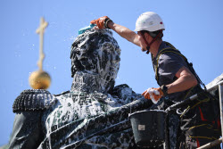 Washing Mikhail Kutuzov statue in St Petersburg, Russia