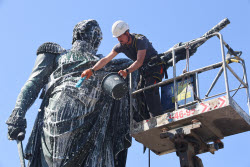 Washing Mikhail Kutuzov statue in St Petersburg, Russia