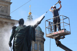 Washing Mikhail Kutuzov statue in St Petersburg, Russia