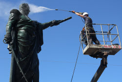Washing Mikhail Kutuzov statue in St Petersburg, Russia