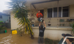 Port Macquarie locals deliver aid amid east coast flooding in Australia