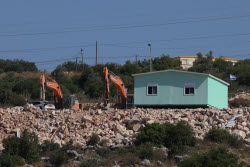 Israeli bulldozers near the West Bank village of Bruqin