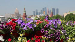 Locals and tourists enjoy the urban landscaping festival 'Summer in Moscow. Gardens and Flowers'.