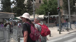 Israeli activists escort Palestinians during March of the Flag in Jerusalem