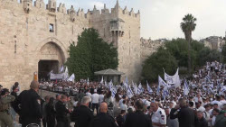 Israeli settlers celebrate the March of the Flags, an ultra-nationalist parade