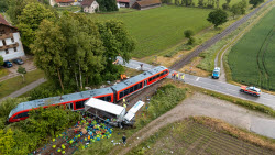 Several injured in collision between train and truck