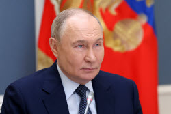 Russia's President Putin meets with families awarded Orders of Parental Glory