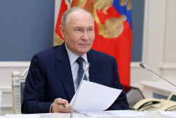 Russia's President Putin meets with families awarded Orders of Parental Glory