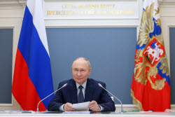 Russia's President Putin meets with families awarded Orders of Parental Glory