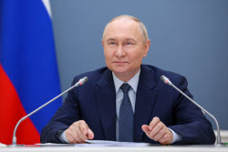 Russia's President Putin meets with families awarded Orders of Parental Glory