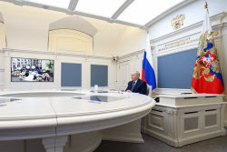 Russia's President Putin meets with families awarded Orders of Parental Glory