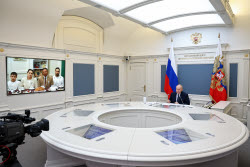 Russia's President Putin meets with families awarded Orders of Parental Glory