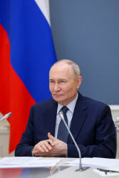 Russia's President Putin meets with families awarded Orders of Parental Glory
