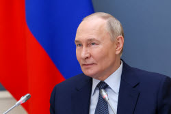 Russia's President Putin meets with families awarded Orders of Parental Glory