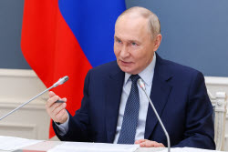 Russia's President Putin meets with families awarded Orders of Parental Glory