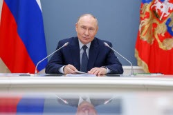 Russia's President Putin meets with families awarded Orders of Parental Glory