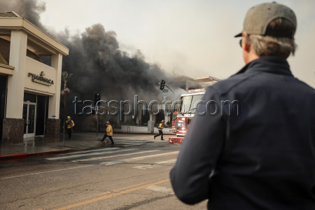Wildfires force thousands of evacuations in Los Angeles area