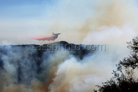 Wildfires continue to rage through Los Angeles area