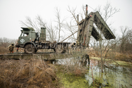 Russian troops build bridge crossing in special military operation zone