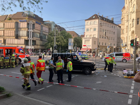 Car drives into group of people