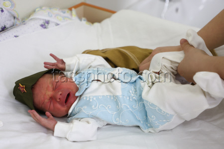 Newborns dressed in military uniform in Kemerovo, Russia