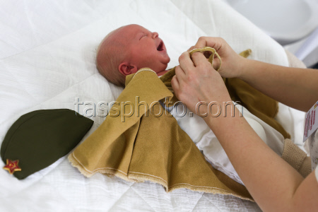Newborns dressed in military uniform in Kemerovo, Russia