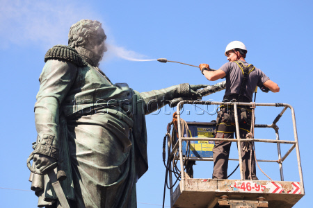 Washing Mikhail Kutuzov statue in St Petersburg, Russia
