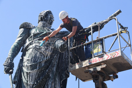 Washing Mikhail Kutuzov statue in St Petersburg, Russia