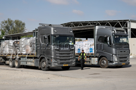 Trucks with humanitarian aid for Gaza wait at Israel's Kerem Shalom crossing